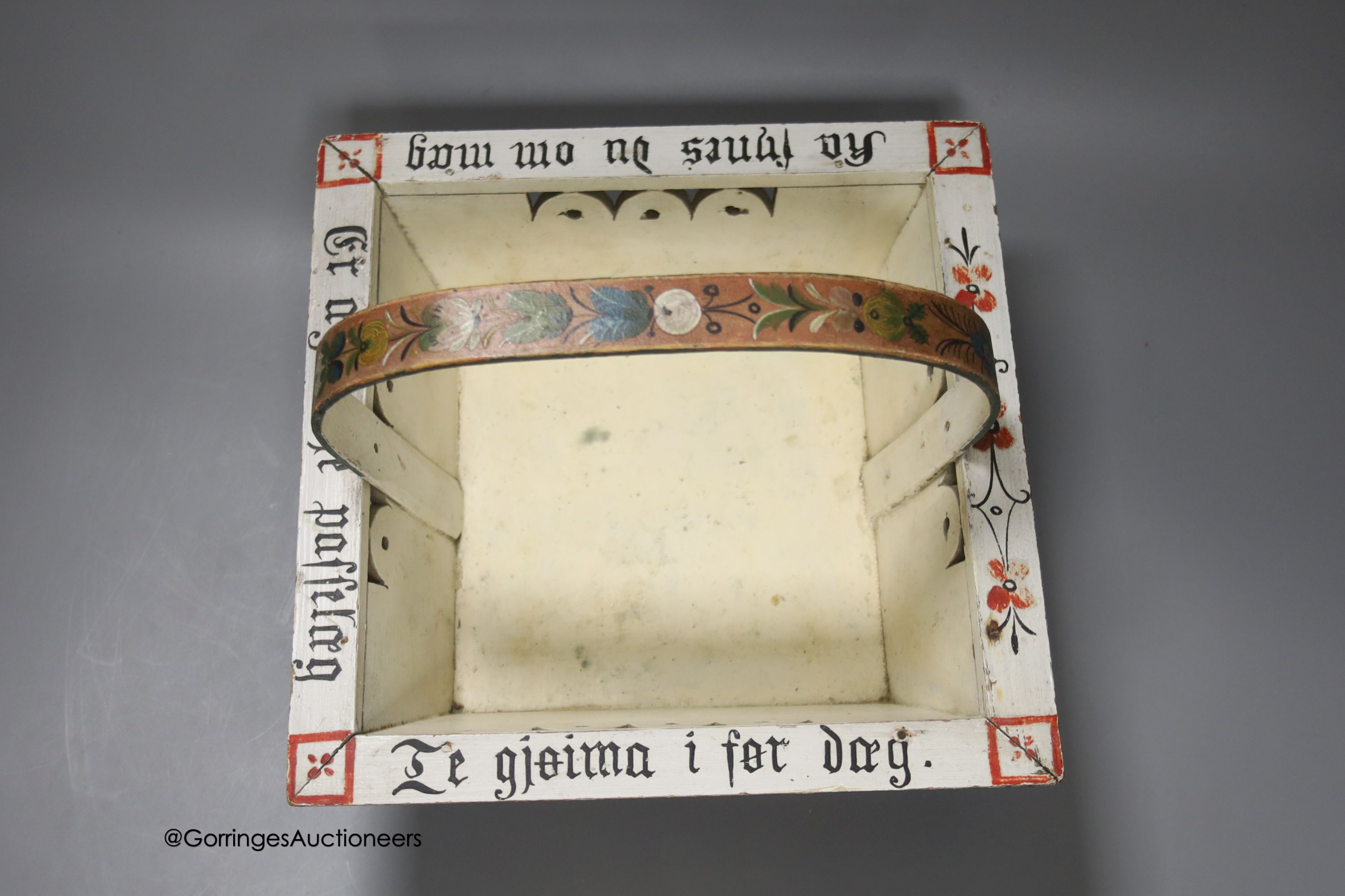 A Norwegian wood basket, painted with script and flowers in polychrome, 25cm